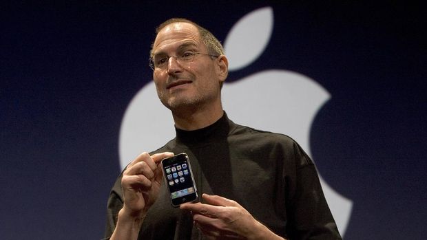 iphone 1 2007 SAN FRANCISCO, CA - JANUARY 9: Apple CEO Steve Jobs holds up the new iPhone that was introduced at Macworld on January 9, 2007 in San Francisco, California. The new iPhone will combine a mobile phone, a widescreen iPod with touch controls and a internet communications device with the ability to use email, web browsing, maps and searching. The iPhone will start shipping in the US in June 2007. (Photo by David Paul Morris/Getty Images)
