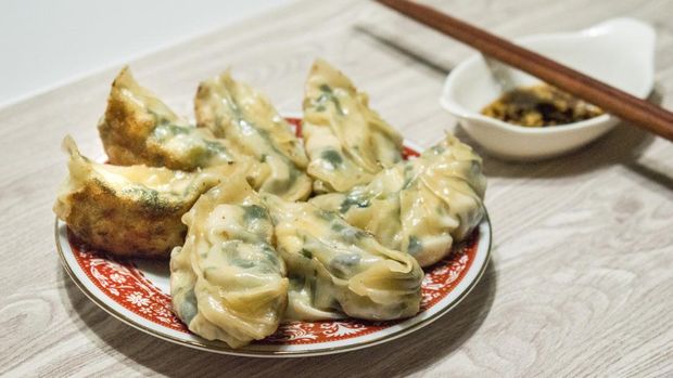 Kuotie or Jiaozi, fried Chinese dumpling in composition.
