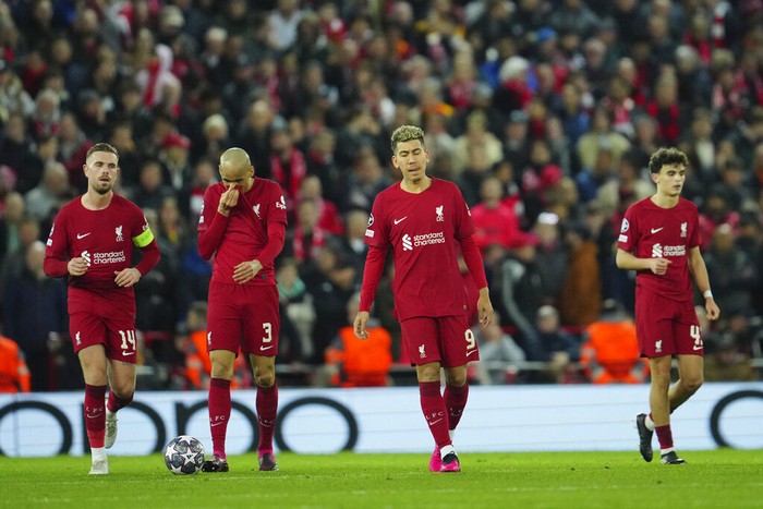 Liverpool players gesture after Real Madrids Karim Benzema, scores his sides fifth goal during the Champions League, round of 16, first leg soccer match between Liverpool and Real Madrid at the Anfield stadium in Liverpool, England, Tuesday, Feb. 21, 2023. (AP Photo/Jon Super)