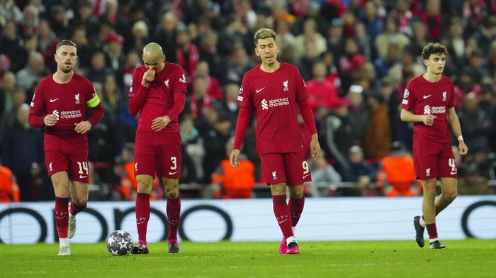 Liverpool players gesture after Real Madrids Karim Benzema, scores his sides fifth goal during the Champions League, round of 16, first leg soccer match between Liverpool and Real Madrid at the Anfield stadium in Liverpool, England, Tuesday, Feb. 21, 2023. (AP Photo/Jon Super)