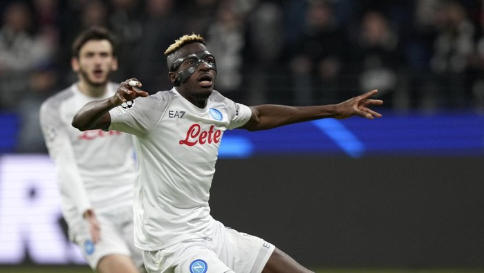 Napolis Victor Osimhen reacts during the Champions League round of 16 second leg soccer match between Eintracht Frankfurt and Napoli, at the Deutsche Bank Arena in Frankfurt, Germany, Tuesday, Feb. 21, 2023. (AP Photo/Michael Probst)