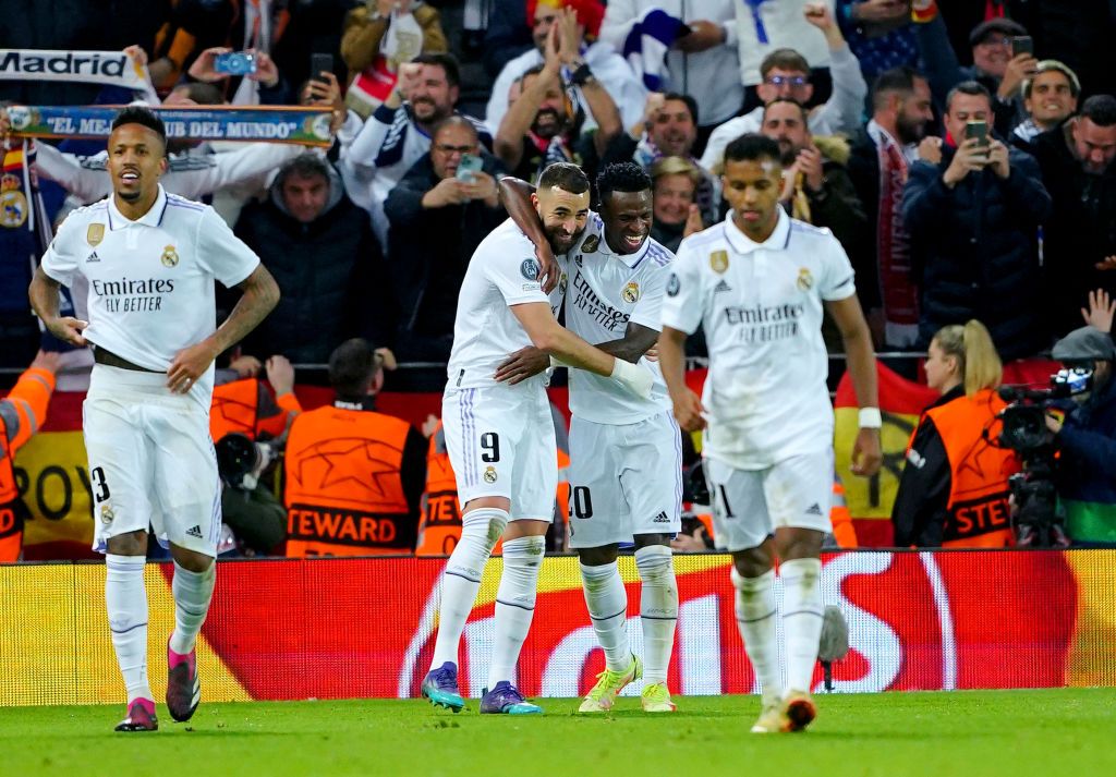 Real Madrid's Karim Benzema celebrates with team-mate Vinicius Junior after scoring their side's fifth goal of the game during the Champions League round of 16 match at Anfield, Liverpool. Picture date: Tuesday February 21, 2023. (Photo by Peter Byrne/PA Images via Getty Images)