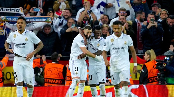 Real Madrids Karim Benzema celebrates with team-mate Vinicius Junior after scoring their sides fifth goal of the game during the Champions League round of 16 match at Anfield, Liverpool. Picture date: Tuesday February 21, 2023. (Photo by Peter Byrne/PA Images via Getty Images)