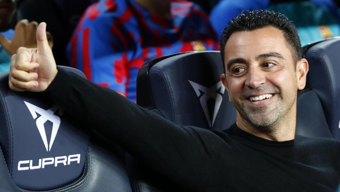 FILE - Barcelonas head coach Xavi Hernandez gives a thumbs up before a Spanish La Liga soccer match between FC Barcelona and Celta Vigo at Camp Nou stadium in Barcelona, Spain, Oct. 9, 2022. Barcelona and Real Madrid resume their fight for the Spanish league title as the competition starts again following a seven-week hiatus for the World Cup. Barcelona has a two-point lead and hosts Espanyol at Camp Nou on Saturday Dec. 31, 2022, a day before defending champion Madrid visits Valladolid. (AP Photo/Joan Monfort, File)