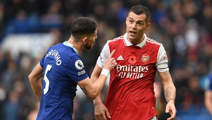 LONDON, ENGLAND - NOVEMBER 06: Granit Xhaka of Arsenal clashes with Jorginho of Chelsea during the Premier League match between Chelsea FC and Arsenal FC at Stamford Bridge on November 06, 2022 in London, England. (Photo by Stuart MacFarlane/Arsenal FC via Getty Images)