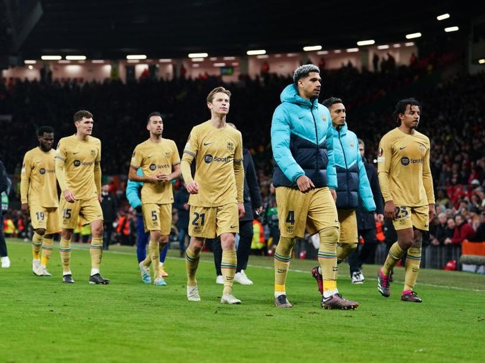 Barcelona players walk off dejected after the UEFA Europa League playoff match at Old Trafford, Manchester. Picture date: Thursday February 23, 2023. (Photo by Martin Rickett/PA Images via Getty Images)