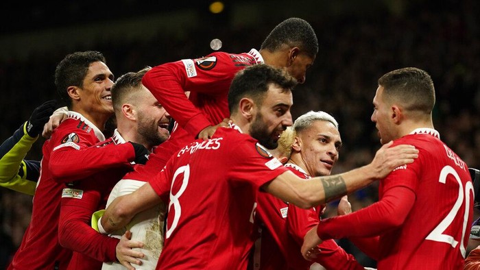Manchester Uniteds Antony, second right, celebrates with his teammates after scoring his sides second goal during the Europa League playoff second leg soccer match between Manchester United and Barcelona at Old Trafford stadium in Manchester, England, Thursday, Feb. 23, 2023. (AP Photo/Dave Thompson)