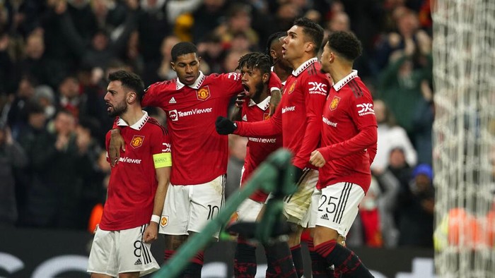 Manchester Uniteds Fred, center, celebrates with his teammates after scoring his sides opening goal during the Europa League playoff second leg soccer match between Manchester United and Barcelona at Old Trafford stadium in Manchester, England, Thursday, Feb. 23, 2023. (AP Photo/Dave Thompson)