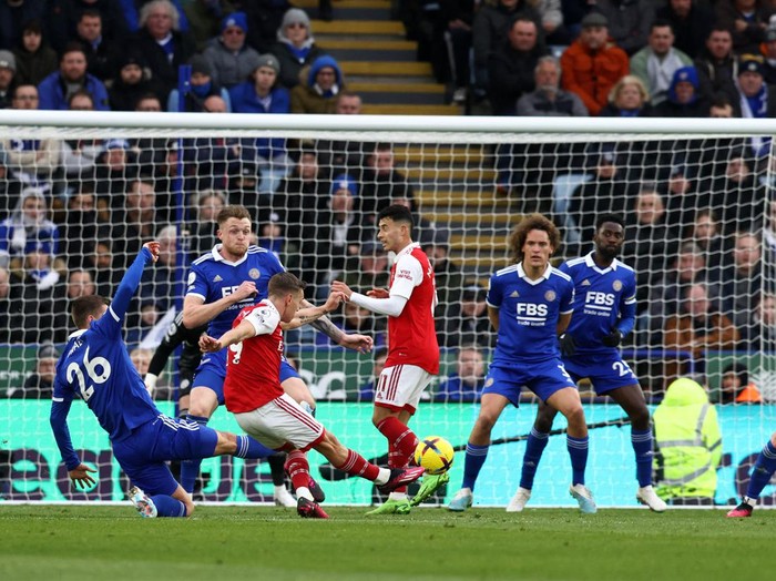 Arsenal's Belgian midfielder Leandro Trossard scores his team's first goal, which is later ruled out after a VAR review, during the English Premier League football match between Leicester City and Arsenal at King Power Stadium in Leicester, central England on February 25, 2023. (Photo by Darren Staples / AFP) / RESTRICTED TO EDITORIAL USE. No use with unauthorized audio, video, data, fixture lists, club/league logos or 'live' services. Online in-match use limited to 120 images. An additional 40 images may be used in extra time. No video emulation. Social media in-match use limited to 120 images. An additional 40 images may be used in extra time. No use in betting publications, games or single club/league/player publications. /  (Photo by DARREN STAPLES/AFP via Getty Images)