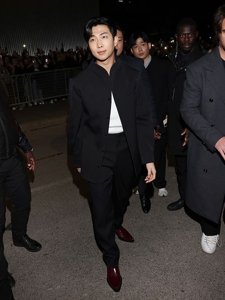 MILAN, ITALY - FEBRUARY 25: RM arrives at Bottega Veneta Winter 2023 Show on February 25, 2023 in Milan, Italy. (Photo by Arnold Jerocki/Getty Images for Bottega Veneta)