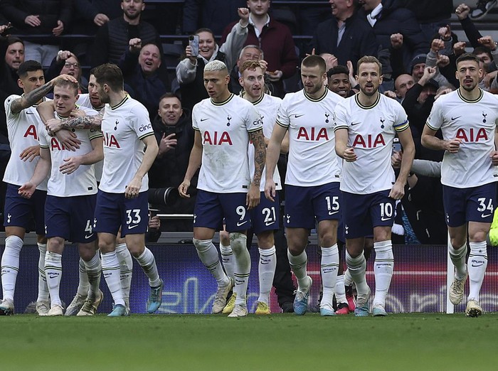 Tottenham players celebrate after Tottenham's Oliver Skipp, second left, scored his side's first goal during the English Premier League soccer match between Tottenham Hotspur and Chelsea at Tottenham Hotspur Stadium in London, Sunday, Feb. 26, 2023.(AP Photo/Ian Walton)
