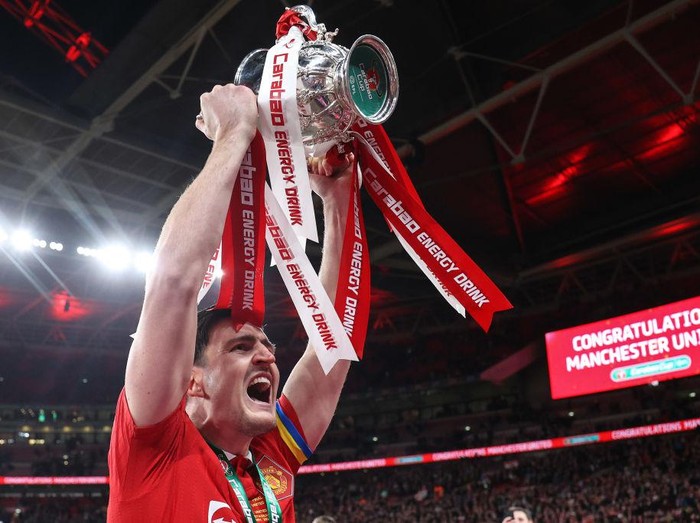 LONDON, ENGLAND - FEBRUARY 26: Harry Maguire of Manchester United celebrates with the trophy during the Carabao Cup Final match between Manchester United and Newcastle United at Wembley Stadium on February 26, 2023 in London, England. (Photo by Charlotte Wilson/Offside/Offside via Getty Images)