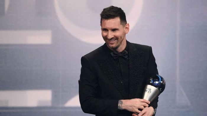 Argentina and Paris Saint-Germain forward Lionel Messi poses on stage after receiving the Best FIFA Mens Player award during the Best FIFA Football Awards 2022 ceremony in Paris on February 27, 2023. (Photo by FRANCK FIFE / AFP) (Photo by FRANCK FIFE/AFP via Getty Images)