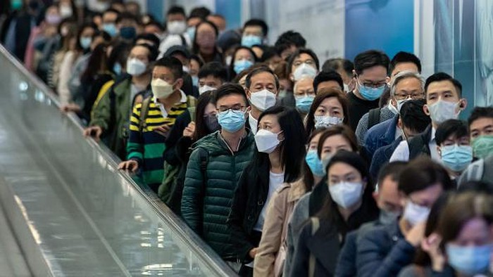 Passengers at Central station, operated by MTR Corp., in Hong Kong, China, on Tuesday, Feb. 28, 2023. Hong Kong will stop requiring masks to be worn in public places from Wednesday, drawing to a close the prolonged Covid periode that damaged its economy and standing in the world. Photographer: Paul Yeung/Bloomberg via Getty Images