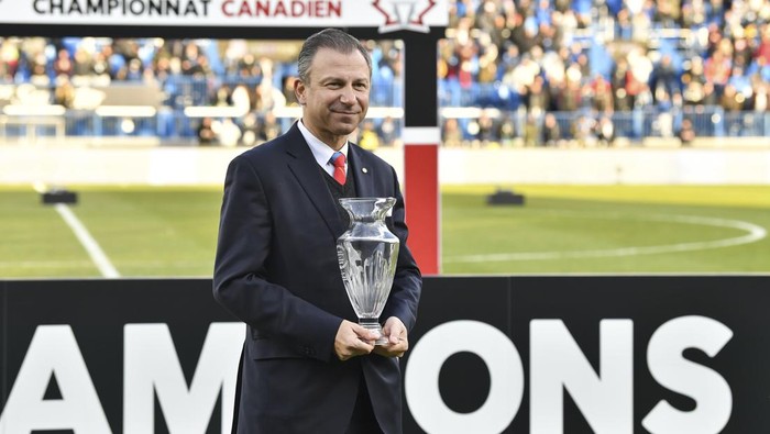 MONTREAL, QC - NOVEMBER 21:  Canada Soccer President Nick Bontis, holds up the George Gross Memorial Trophy given to the MVP of the competition between CF Montréal and the Toronto FC during the 2021 Canadian Championship Final at Stade Saputo on November 21, 2021 in Montreal, Canada.  CF Montréal defeated Toronto FC 1-0 to become the 2021 Canadian Champions.  (Photo by Minas Panagiotakis/Getty Images)