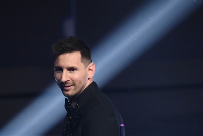 Argentina and Paris Saint-Germain forward Lionel Messi poses on stage after receiving the Best FIFA Mens Player award during the Best FIFA Football Awards 2022 ceremony in Paris on February 27, 2023. (Photo by FRANCK FIFE / AFP) (Photo by FRANCK FIFE/AFP via Getty Images)