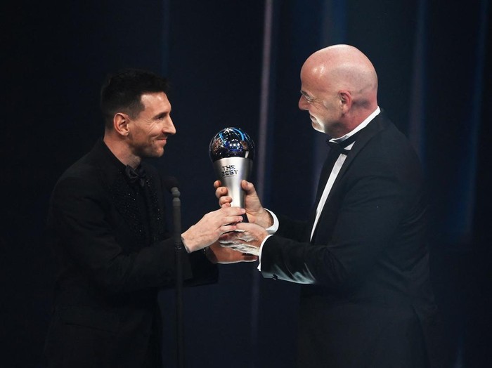 Argentina and Paris Saint-Germain forward Lionel Messi (L) receives from FIFA President Gianni Infantino the Best FIFA Mens Player award during the Best FIFA Football Awards 2022 ceremony in Paris on February 27, 2023. (Photo by FRANCK FIFE / AFP) (Photo by FRANCK FIFE/AFP via Getty Images)