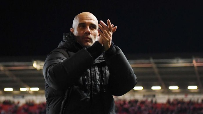 BRISTOL, ENGLAND - FEBRUARY 28: Pep Guardiola, Manager of Manchester City, applauds their fans after the Emirates FA Cup Fifth Round match between Bristol City and Manchester City at Ashton Gate on February 28, 2023 in Bristol, England. (Photo by Manchester City FC/Manchester City FC via Getty Images)