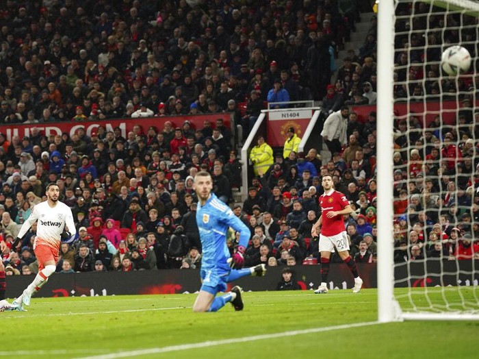 West Ham's Said Benrahma, third left, scores his side's opening goal during the English FA Cup fifth round soccer match between Manchester United and West Ham at Old Trafford stadium in Manchester, England, Wednesday, March 1, 2023. (AP Photo/Dave Thompson)