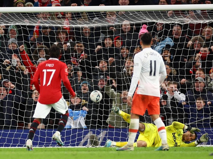 Soccer Football - FA Cup - Fifth Round - Manchester United v West Ham United - Old Trafford, Manchester, Britain - March 1, 2023 Manchester United's Fred scores their third goal past West Ham United's Alphonse Areola REUTERS/Carl Recine