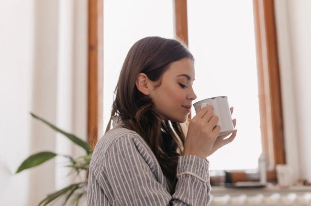 The woman is drinking