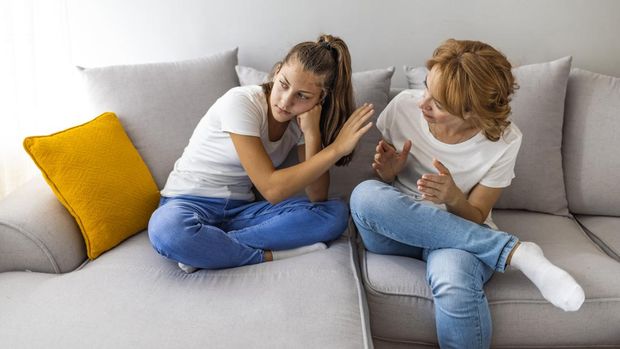 Grown up daughter arguing with nervous old mature mother.