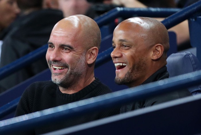 MANCHESTER, ENGLAND - SEPTEMBER 11: Pep Guardiola, Manager of Manchester City Legends, and Vincent Kompany speak during Vincent Kompanys Testimonial Match between Manchester City Legends and Premier League All-Stars XI at Etihad Stadium on September 11, 2019 in Manchester, England. (Photo by Victoria Haydn/Manchester City FC via Getty Images)