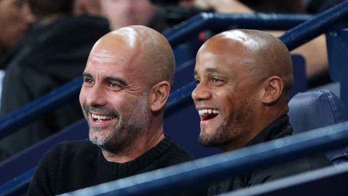 MANCHESTER, ENGLAND - SEPTEMBER 11: Pep Guardiola, Manager of Manchester City Legends, and Vincent Kompany speak during Vincent Kompanys Testimonial Match between Manchester City Legends and Premier League All-Stars XI at Etihad Stadium on September 11, 2019 in Manchester, England. (Photo by Victoria Haydn/Manchester City FC via Getty Images)