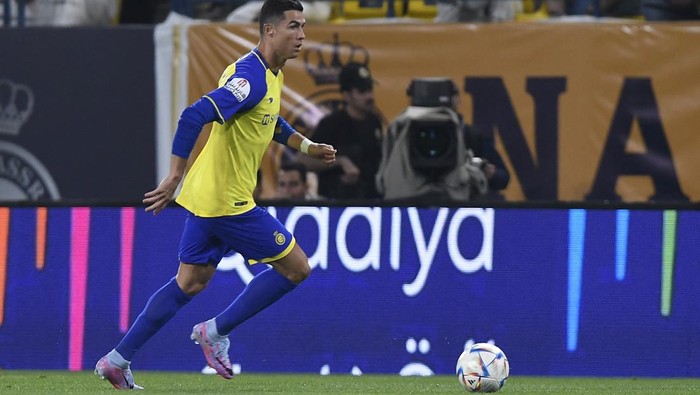 Nassrs Portuguese forward Cristiano Ronaldo runs with the ball during the Saudi Pro League football match between Al-Nassr and Al-Batin at the Mrsool Park Stadium in the Saudi capital Riyadh on March 3, 2023. (Photo by AFP) (Photo by -/AFP via Getty Images)
