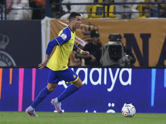 Nassrs Portuguese forward Cristiano Ronaldo runs with the ball during the Saudi Pro League football match between Al-Nassr and Al-Batin at the Mrsool Park Stadium in the Saudi capital Riyadh on March 3, 2023. (Photo by AFP) (Photo by -/AFP via Getty Images)