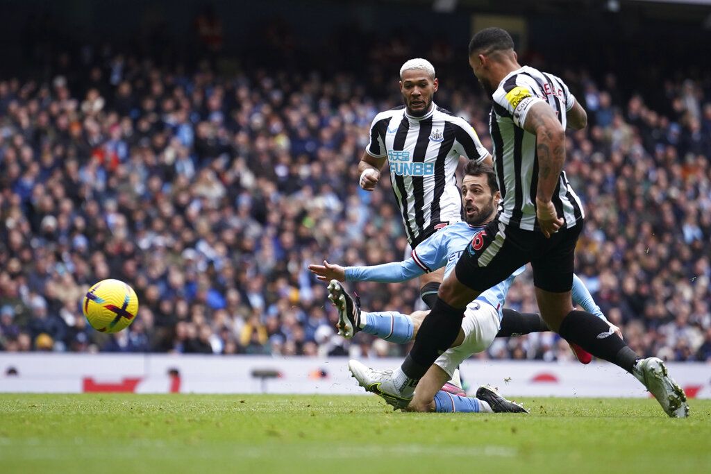 Manchester City's Bernardo Silva scores his side's second goal during the English Premier League soccer match between Manchester City and and Newcastle, at the Etihad stadium in Manchester, England, Saturday, March 4, 2023. (AP Photo/Dave Thompson)