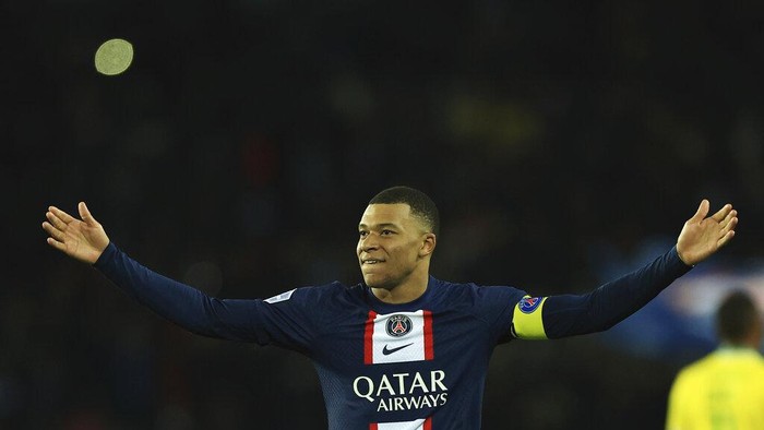 PSGs Kylian Mbappe celebrates after scoring his sides fourth goal during the French League One soccer match between Paris Saint-Germain and Nantes at the Parc des Princes in Paris, Saturday, March 4, 2023. (AP Photo/Aurelien Morissard)