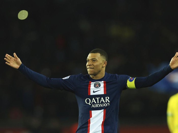 PSG's Kylian Mbappe celebrates after scoring his side's fourth goal during the French League One soccer match between Paris Saint-Germain and Nantes at the Parc des Princes in Paris, Saturday, March 4, 2023. (AP Photo/Aurelien Morissard)