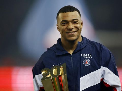 Soccer Football - Ligue 1 - Paris St Germain v Nantes - Parc des Princes, Paris, France - March 4, 2023  Paris St Germain's Kylian Mbappe celebrates with a trophy during the ceremony after becoming Paris St Germain's all time top goalscorer with 201 goals REUTERS/Sarah Meyssonnier