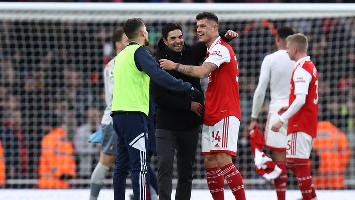 LONDON, ENGLAND - MARCH 04: Mikel Arteta the manager / head coach of Arsenal and Granit Xhaka at full time of the Premier League match between Arsenal FC and AFC Bournemouth at Emirates Stadium on March 4, 2023 in London, United Kingdom. (Photo by James Williamson - AMA/Getty Images)
