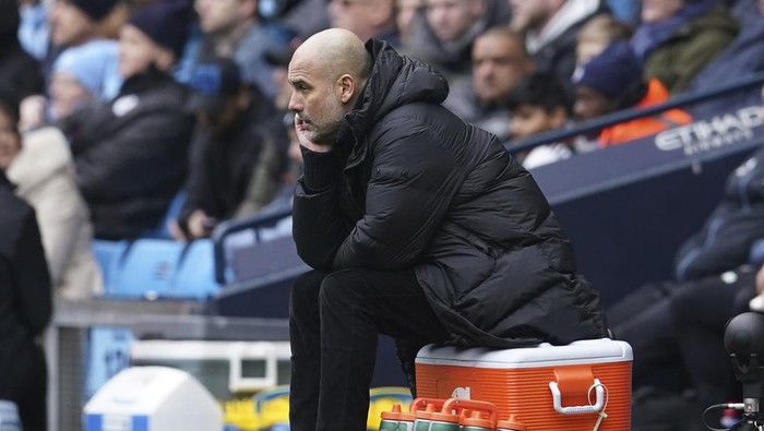 Manchester Citys head coach Pep Guardiola watches during the English Premier League soccer match between Manchester City and and Newcastle, at the Etihad stadium in Manchester, England, Saturday, March 4, 2023. (AP Photo/Dave Thompson)