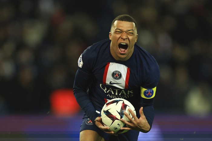 PSGs Kylian Mbappe celebrates after scoring his sides fourth goal during the French League One soccer match between Paris Saint-Germain and Nantes at the Parc des Princes in Paris, Saturday, March 4, 2023. (AP Photo/Aurelien Morissard)