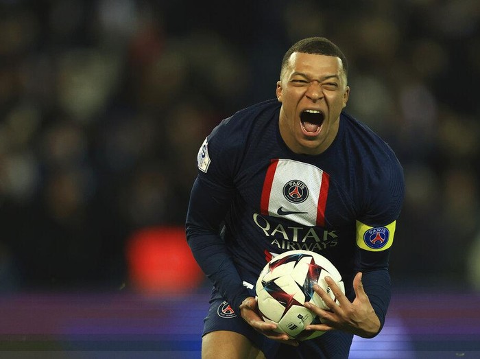 PSG's Kylian Mbappe celebrates after scoring his side's fourth goal during the French League One soccer match between Paris Saint-Germain and Nantes at the Parc des Princes in Paris, Saturday, March 4, 2023. (AP Photo/Aurelien Morissard)