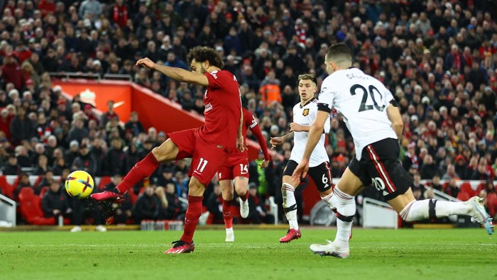 Soccer Football - Premier League - Liverpool v Manchester United - Anfield, Liverpool, Britain - March 5, 2023 Liverpools Mohamed Salah scores their fourth goal REUTERS/Carl Recine EDITORIAL USE ONLY. No use with unauthorized audio, video, data, fixture lists, club/league logos or live services. Online in-match use limited to 75 images, no video emulation. No use in betting, games or single club /league/player publications.  Please contact your account representative for further details.