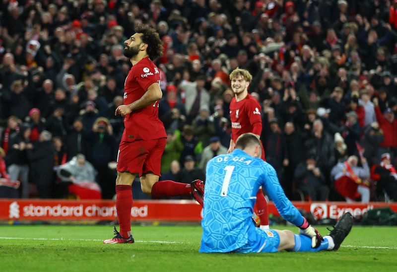 Soccer Football - Premier League - Liverpool v Manchester United - Anfield, Liverpool, Britain - March 5, 2023 Liverpool's Mohamed Salah celebrates scoring their fourth goal as Manchester United's David de Gea looks dejected REUTERS/Carl Recine EDITORIAL USE ONLY. No use with unauthorized audio, video, data, fixture lists, club/league logos or 'live' services. Online in-match use limited to 75 images, no video emulation. No use in betting, games or single club /league/player publications.  Please contact your account representative for further details.