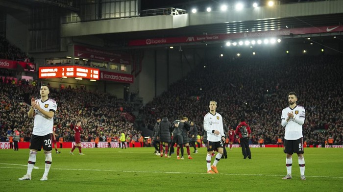 Manchester Uniteds Diogo Dalot, left, and Manchester Uniteds Bruno Fernandes, right, react after the the English Premier League soccer match between Liverpool and Manchester United at Anfield in Liverpool, England, Sunday, March 5, 2023. Liverpool won the match 7-0. (AP Photo/Jon Super)