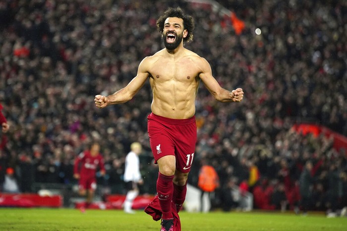 Liverpools Mohamed Salah celebrates after scoring his sides sixth goal during the English Premier League soccer match between Liverpool and Manchester United at Anfield in Liverpool, England, Sunday, March 5, 2023. (Peter Byrne/PA via AP)