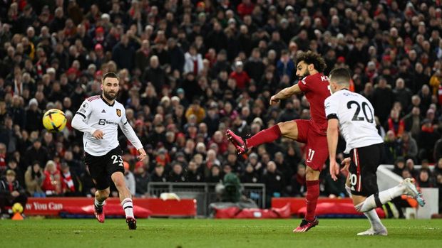 LIVERPOOL, ENGLAND - MARCH 05:  (THE SUN OUT.THE SUN ON SUNDAY OUT )  Mohamed Salah of Liverpool scores the fourth goal making the score during the Premier League match between Liverpool FC and Manchester United at Anfield on March 05, 2023 in Liverpool, England. (Photo by Andrew Powell/Liverpool FC via Getty Images)