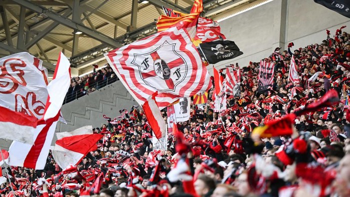 11 February 2023, Baden-Württemberg, Freiburg im Breisgau: Soccer, Bundesliga, SC Freiburg - VfB Stuttgart, Matchday 20, Europa-Park Stadion. Fans of SC Freiburg. Photo: Bernd Weißbrod/dpa - IMPORTANT NOTE: In accordance with the requirements of the DFL Deutsche Fußball Liga and the DFB Deutscher Fußball-Bund, it is prohibited to use or have used photographs taken in the stadium and/or of the match in the form of sequence pictures and/or video-like photo series. (Photo by Bernd Weißbrod/picture alliance via Getty Images)