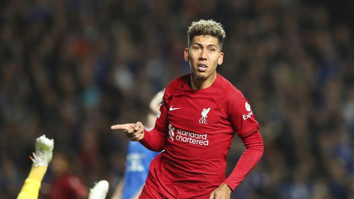 Liverpools Roberto Firmino celebrates after scoring his sides second goal during the Champions League Group A soccer match between Rangers and Liverpool at Ibrox stadium in Glasgow, Scotland, Wednesday, Oct. 12, 2022. (AP Photo/Scott Heppell)