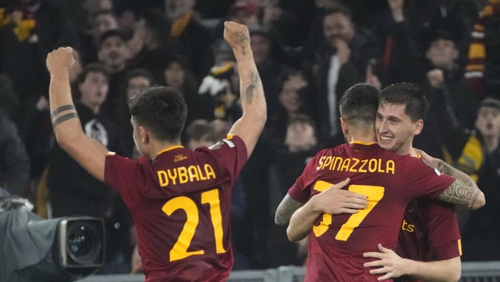 Romas Marash Kumbulla, right, celebrates with Romas Paulo Dybala. Left, and Romas Leonardo Spinazzola after scoring his sides 2nd goal during the Europa League soccer match between Roma and Real Sociedad at Romes Olympic stadium, Thursday, March 9, 2023. (AP Photo/Gregorio Borgia)