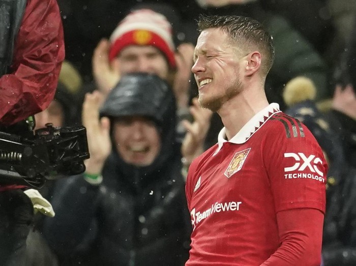 Manchester United's Wout Weghorst celebrates after scoring his side's fourth goal during the Europa League round of 16 first leg soccer match between Manchester United and Real Betis at the Old Trafford stadium in Manchester, Thursday, March 9, 2023. (AP Photo/Dave Thompson)