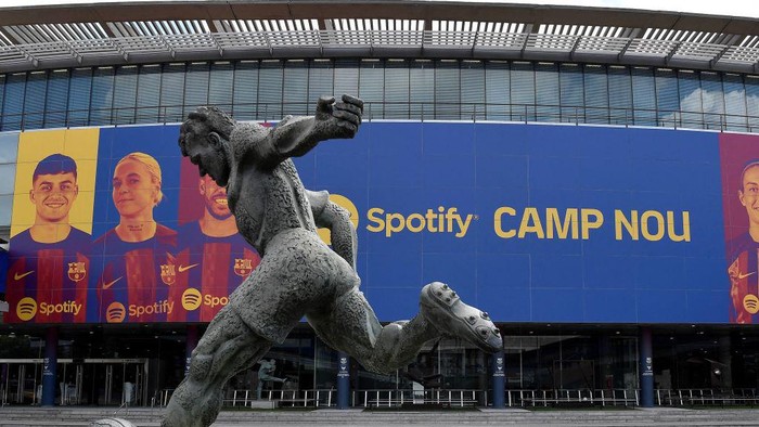 This photograph taken on July 1, 2022 shows the logo of Spotify Technology S.A on the banner at the entrance of the Camp Nou stadium in Barcelona. (Photo by Pau BARRENA / AFP) (Photo by PAU BARRENA/AFP via Getty Images)