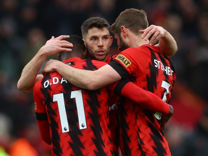 Bournemouth Soccer Football - Premier League - AFC Bournemouth v Liverpool - Vitality Stadium, Bournemouth, Britain - March 11, 2023 AFC Bournemouth's Ryan Christie, Dango Outtara and Jack Stephens celebrate after the match Action Images via Reuters/Paul Childs EDITORIAL USE ONLY. No use with unauthorized audio, video, data, fixture lists, club/league logos or 'live' services. Online in-match use limited to 75 images, no video emulation. No use in betting, games or single club /league/player publications. Please contact your account representative for further details.