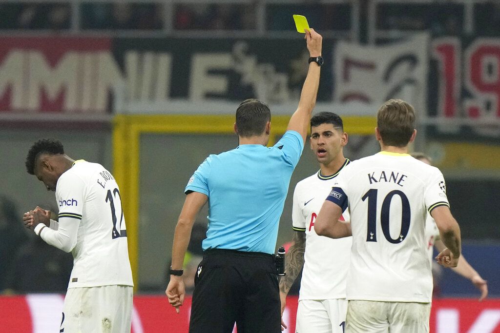 Tottenham's Cristian Romero, bottom, fouls AC Milan's Rafael Leao during the Champions League round of 16 second leg soccer match between Tottenham Hotspur and AC Milan at the Tottenham Hotspur stadium in London, Wednesday, March 8, 2023. (AP Photo/Alastair Grant)